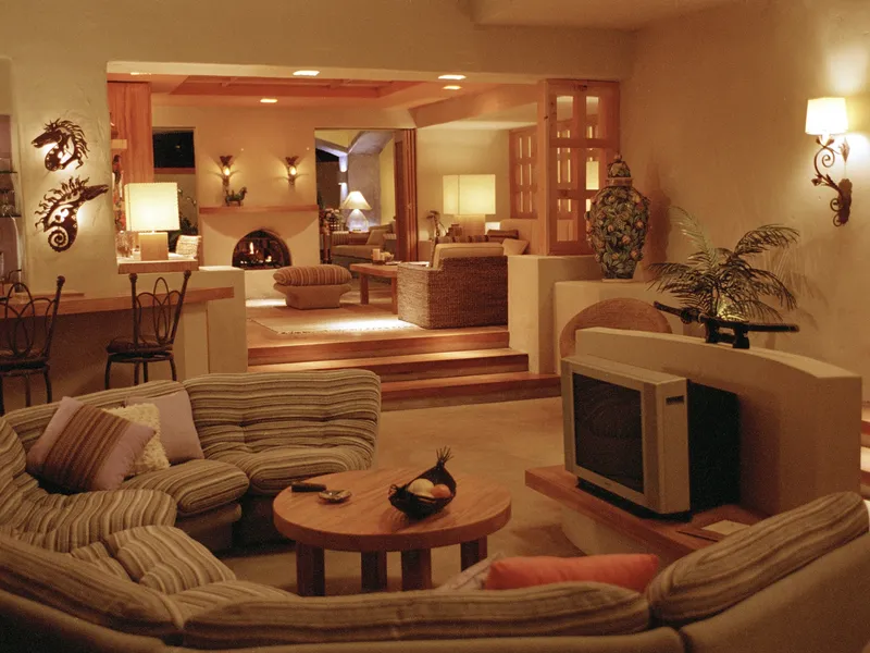 A warm eighties living room with a big TV